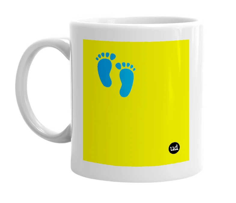 White mug with '👣' in bold black letters
