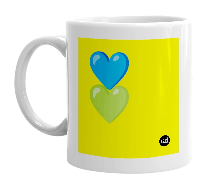 White mug with '💙💚' in bold black letters
