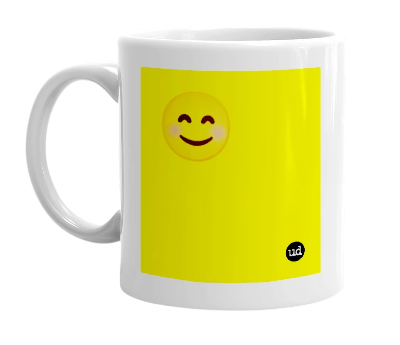 White mug with '😊' in bold black letters