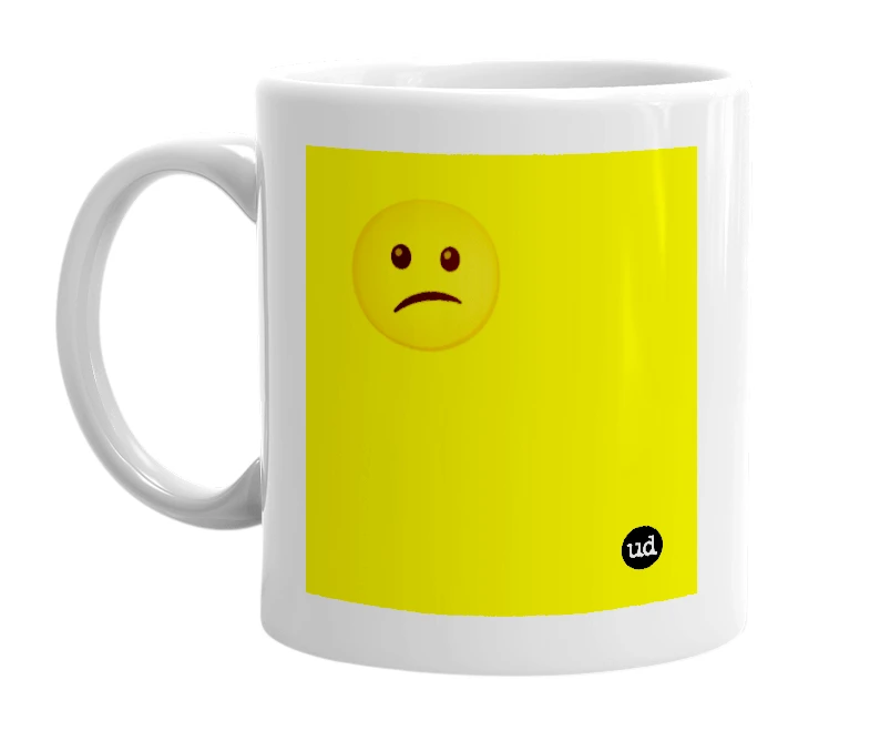 White mug with '😕' in bold black letters