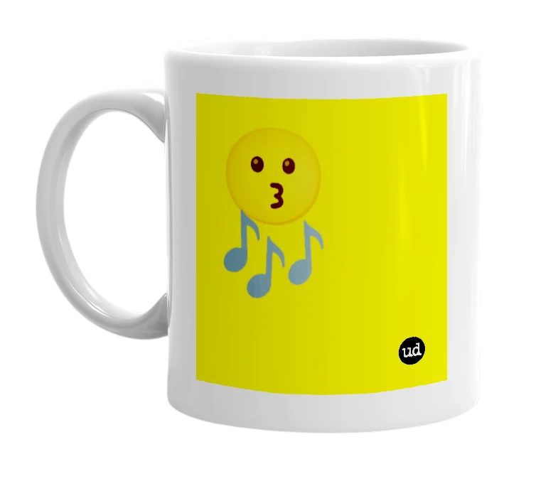 White mug with '😗🎶' in bold black letters