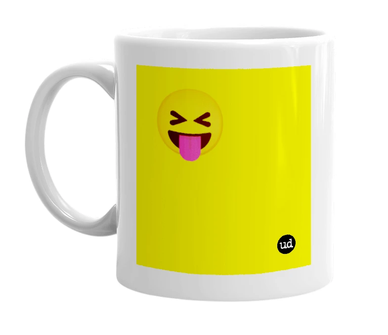 White mug with '😝' in bold black letters