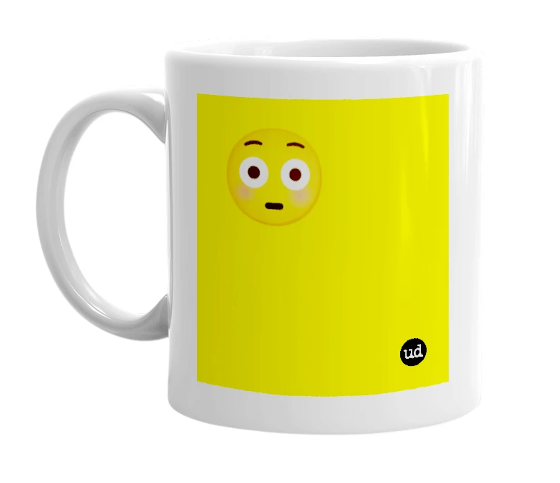 White mug with '😳' in bold black letters