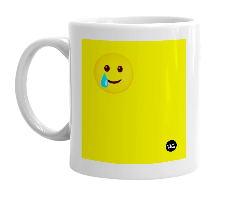 White mug with '🥲' in bold black letters