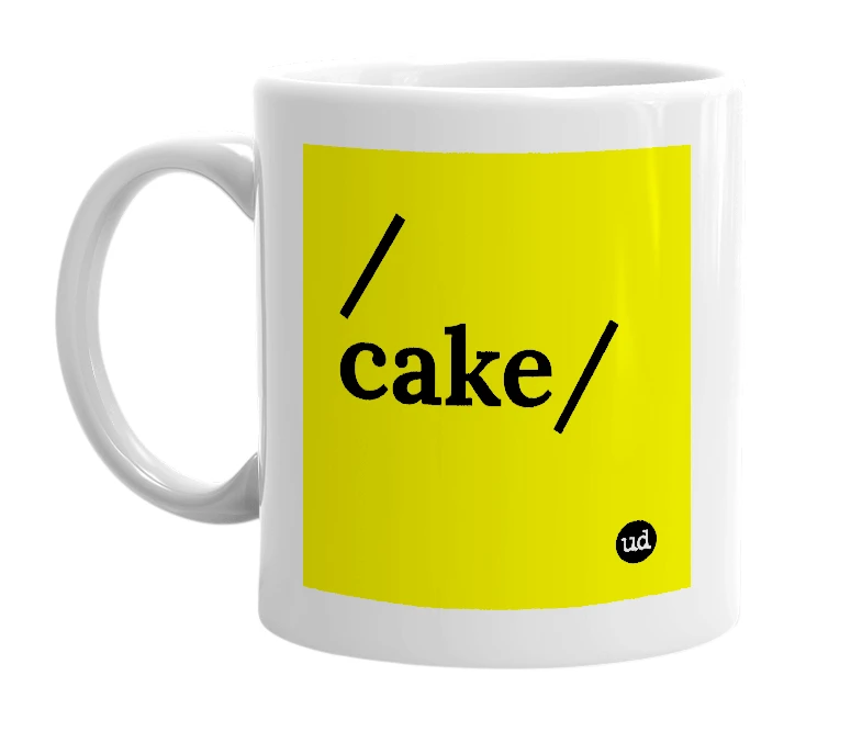 White mug with '/cake/' in bold black letters