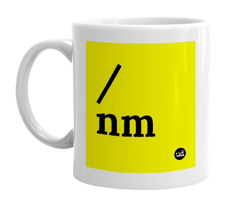 White mug with '/nm' in bold black letters