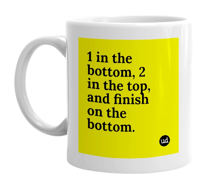 White mug with '1 in the bottom, 2 in the top, and finish on the bottom.' in bold black letters