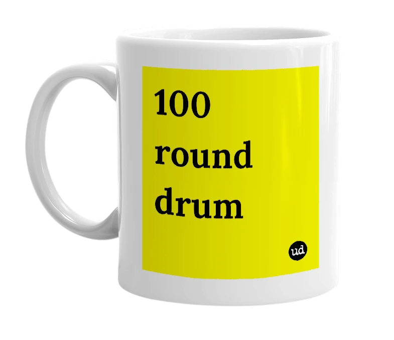 White mug with '100 round drum' in bold black letters