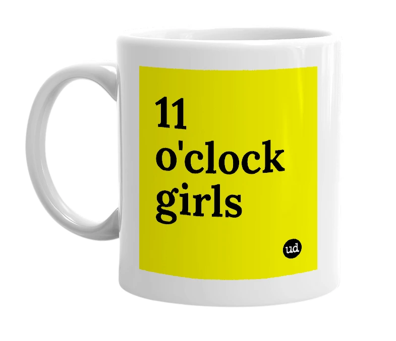 White mug with '11 o'clock girls' in bold black letters