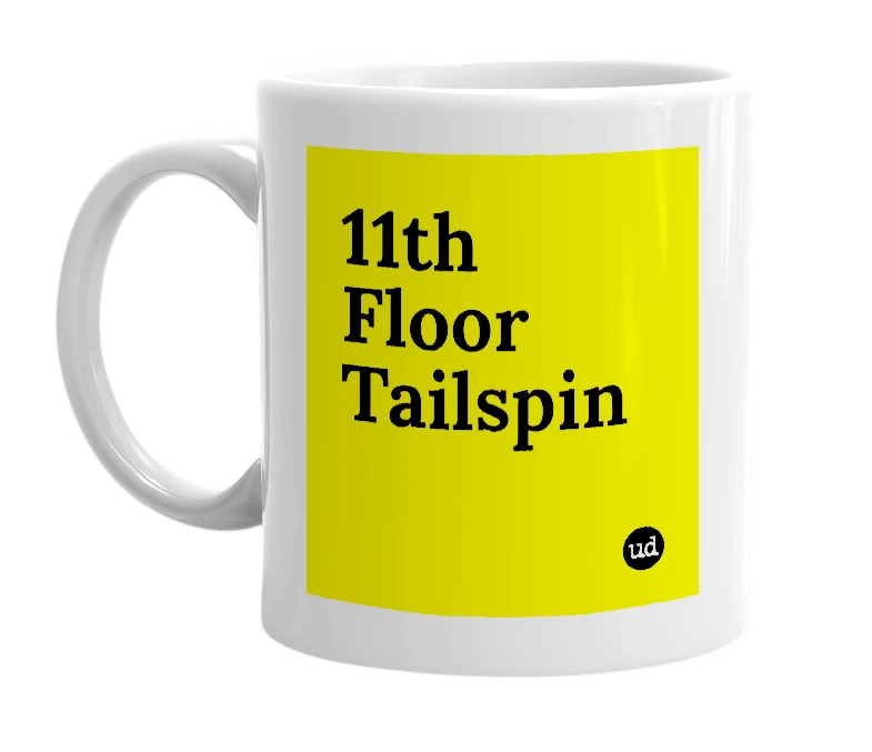 White mug with '11th Floor Tailspin' in bold black letters