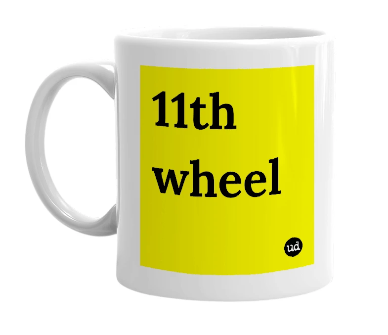 White mug with '11th wheel' in bold black letters