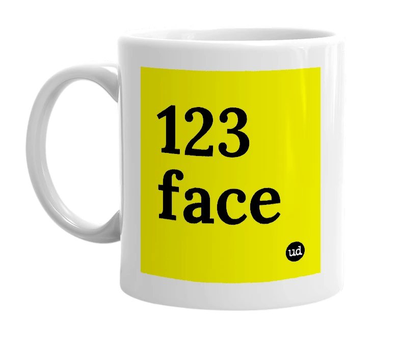 White mug with '123 face' in bold black letters