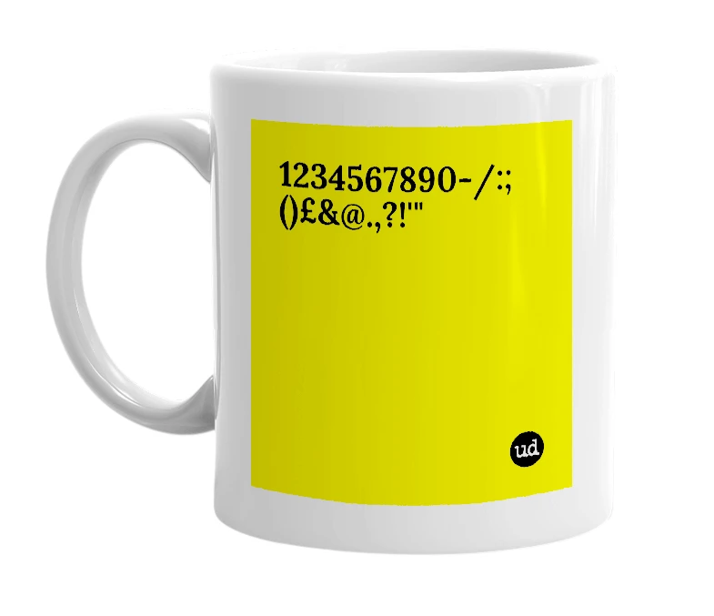 White mug with '1234567890-/:;()£&@.,?!'"' in bold black letters