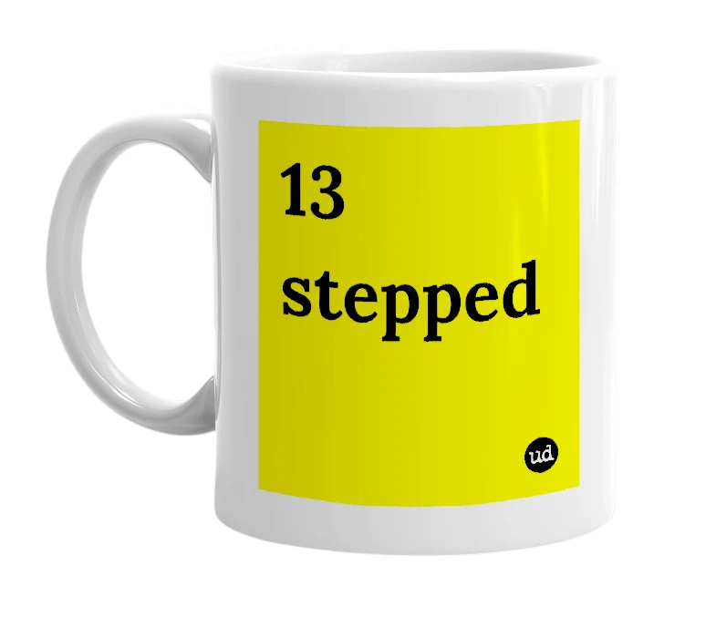 White mug with '13 stepped' in bold black letters
