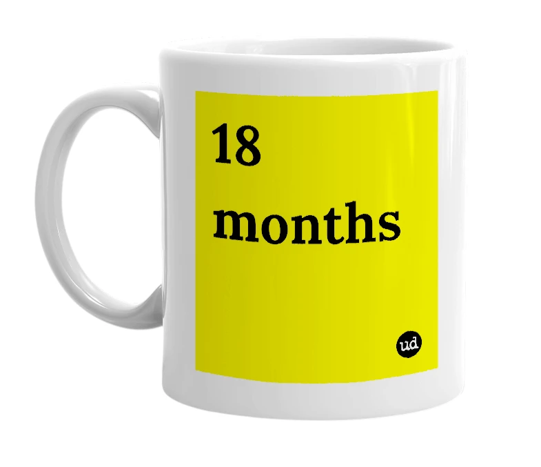 White mug with '18 months' in bold black letters