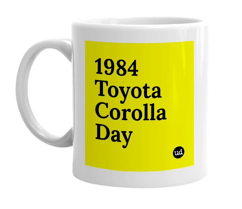 White mug with '1984 Toyota Corolla Day' in bold black letters