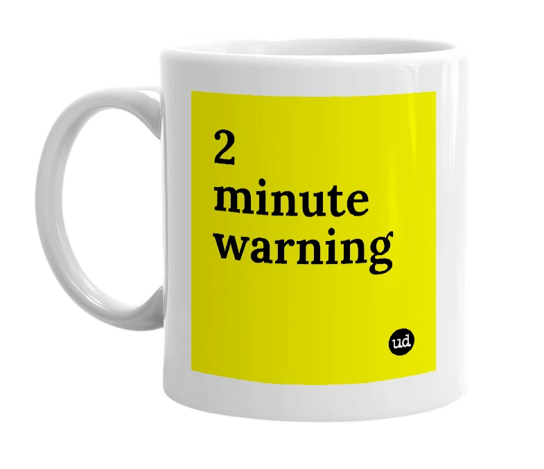 White mug with '2 minute warning' in bold black letters