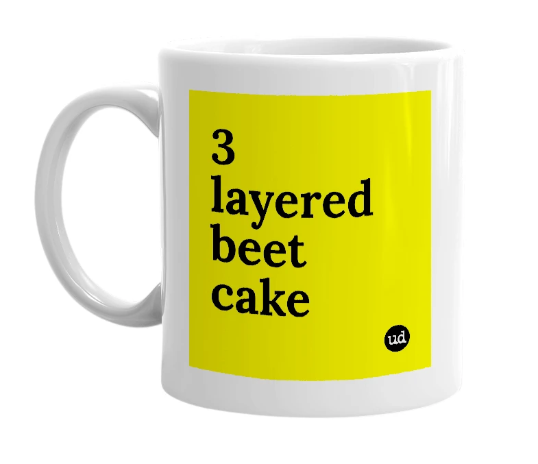 White mug with '3 layered beet cake' in bold black letters