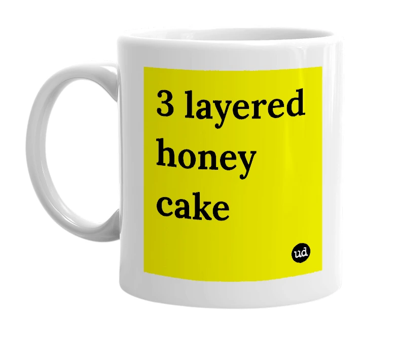 White mug with '3 layered honey cake' in bold black letters
