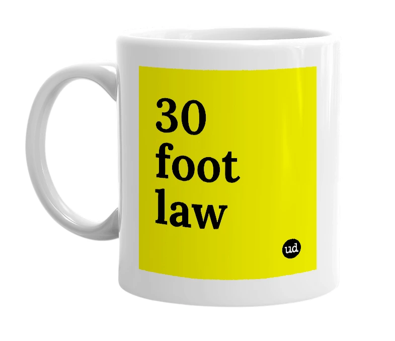 White mug with '30 foot law' in bold black letters