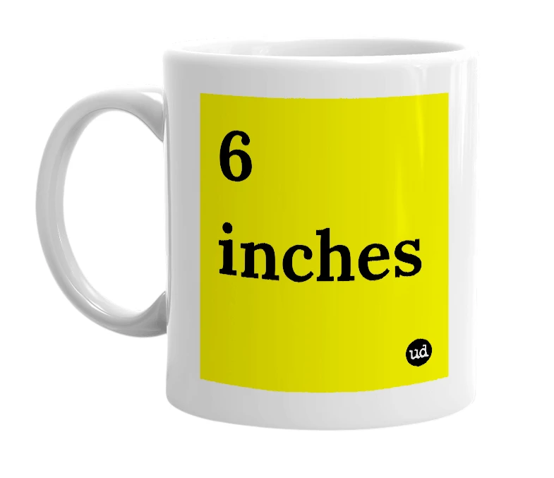 White mug with '6 inches' in bold black letters