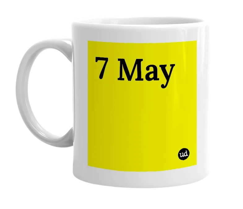 White mug with '7 May' in bold black letters