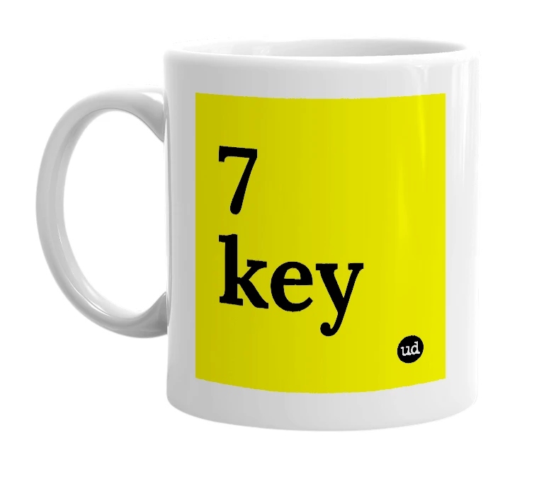 White mug with '7 key' in bold black letters