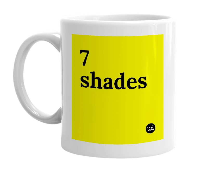 White mug with '7 shades' in bold black letters