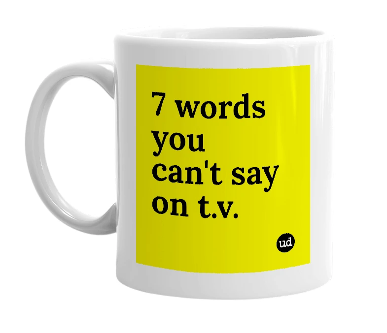 White mug with '7 words you can't say on t.v.' in bold black letters