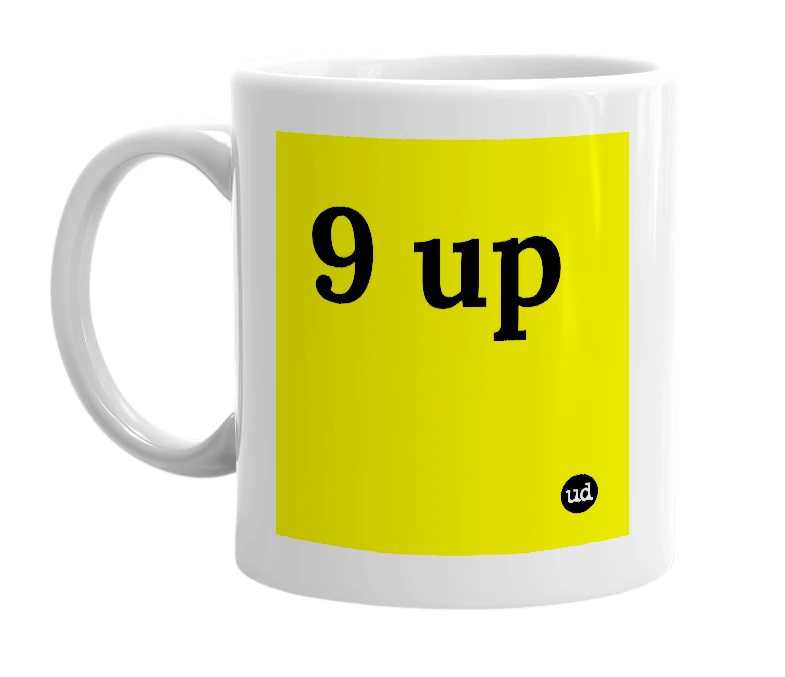 White mug with '9 up' in bold black letters