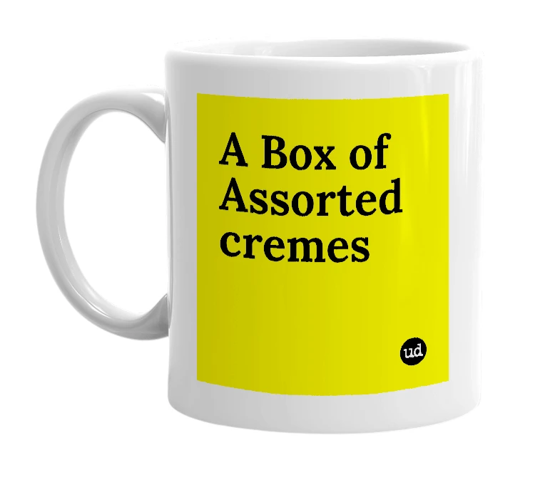 White mug with 'A Box of Assorted cremes' in bold black letters