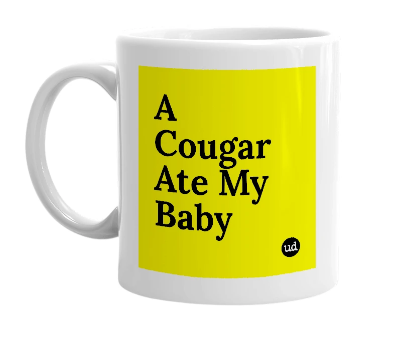 White mug with 'A Cougar Ate My Baby' in bold black letters