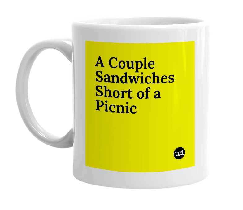 White mug with 'A Couple Sandwiches Short of a Picnic' in bold black letters