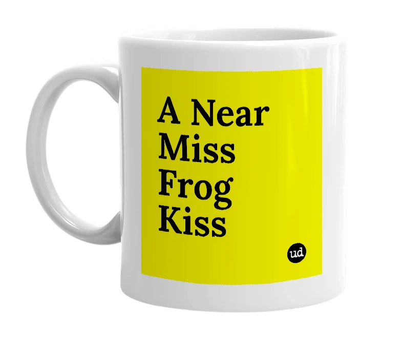 White mug with 'A Near Miss Frog Kiss' in bold black letters