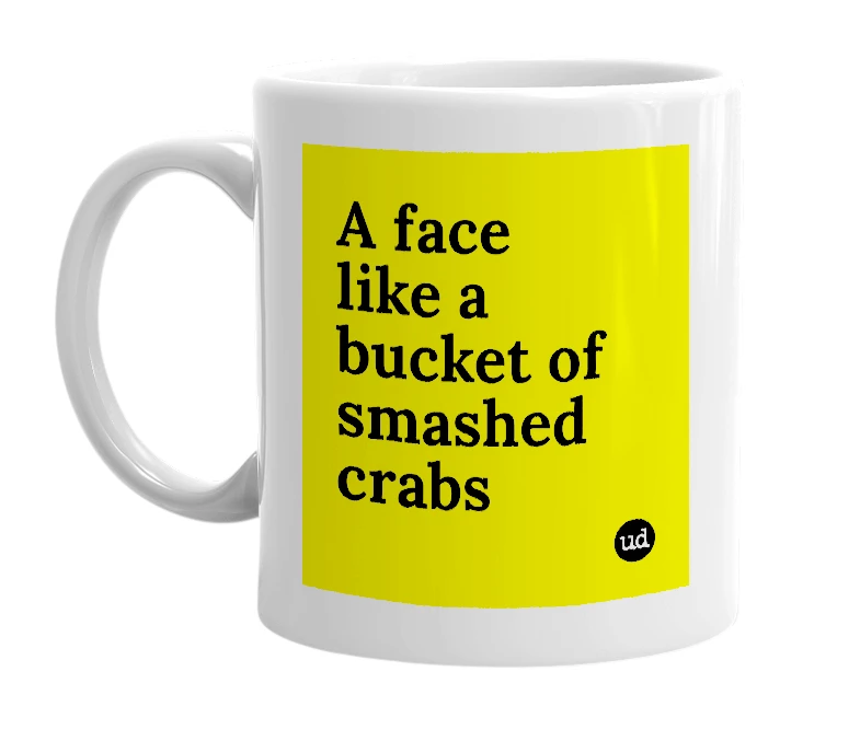 White mug with 'A face like a bucket of smashed crabs' in bold black letters