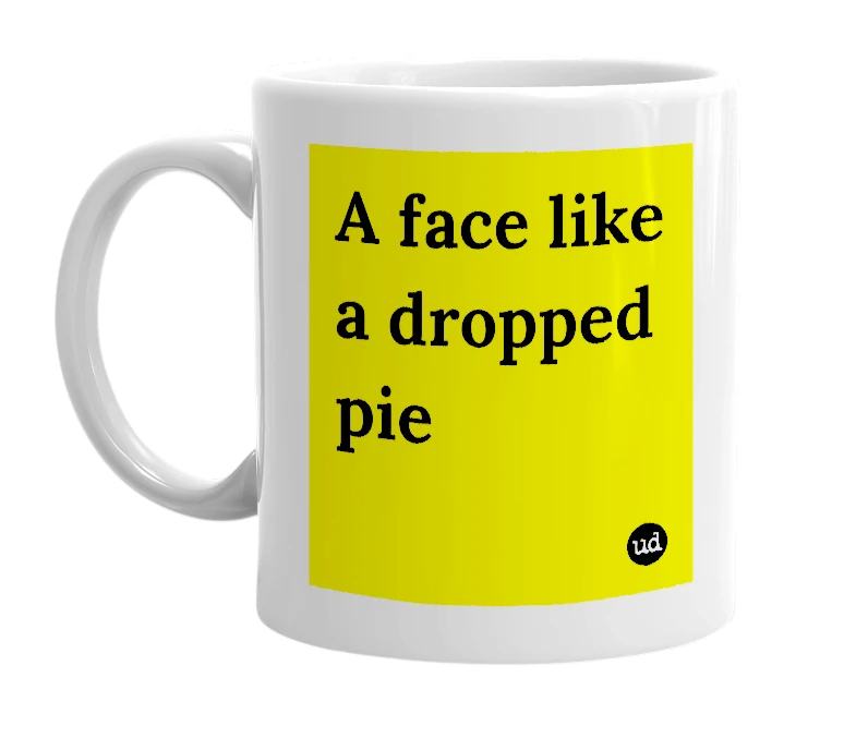 White mug with 'A face like a dropped pie' in bold black letters