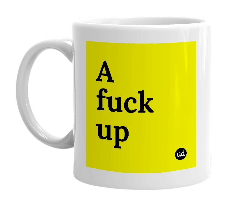 White mug with 'A fuck up' in bold black letters