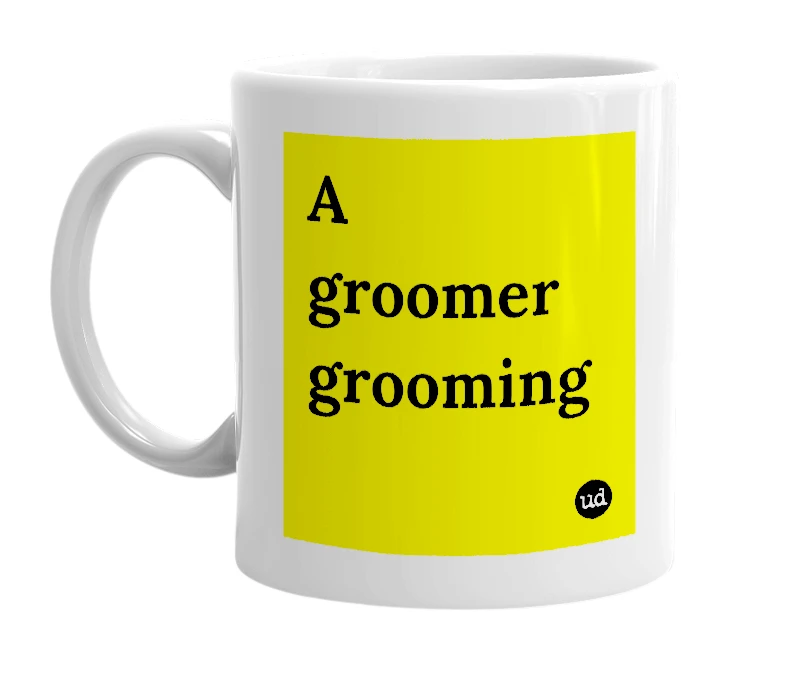 White mug with 'A groomer grooming' in bold black letters