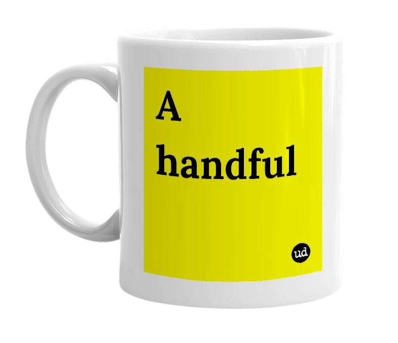 White mug with 'A handful' in bold black letters