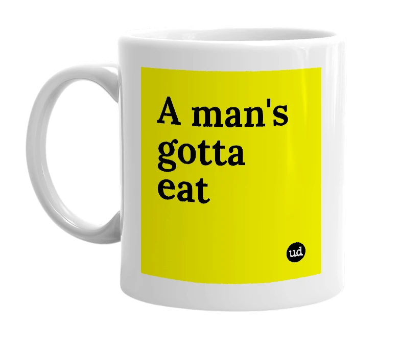 White mug with 'A man's gotta eat' in bold black letters