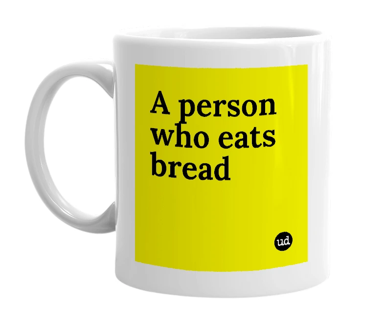White mug with 'A person who eats bread' in bold black letters