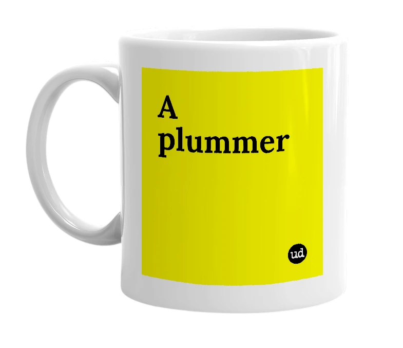 White mug with 'A plummer' in bold black letters