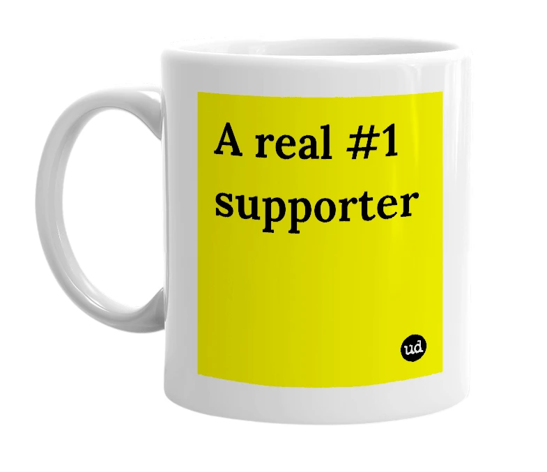 White mug with 'A real #1 supporter' in bold black letters