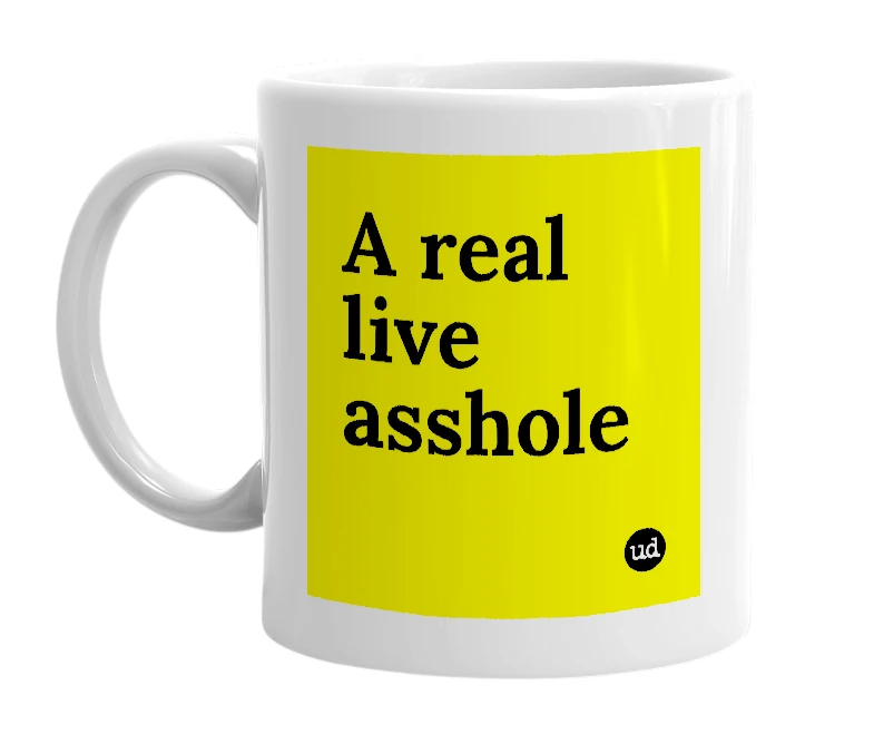 White mug with 'A real live asshole' in bold black letters