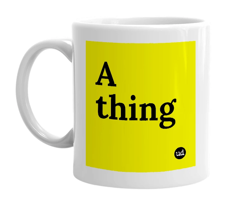 White mug with 'A thing' in bold black letters