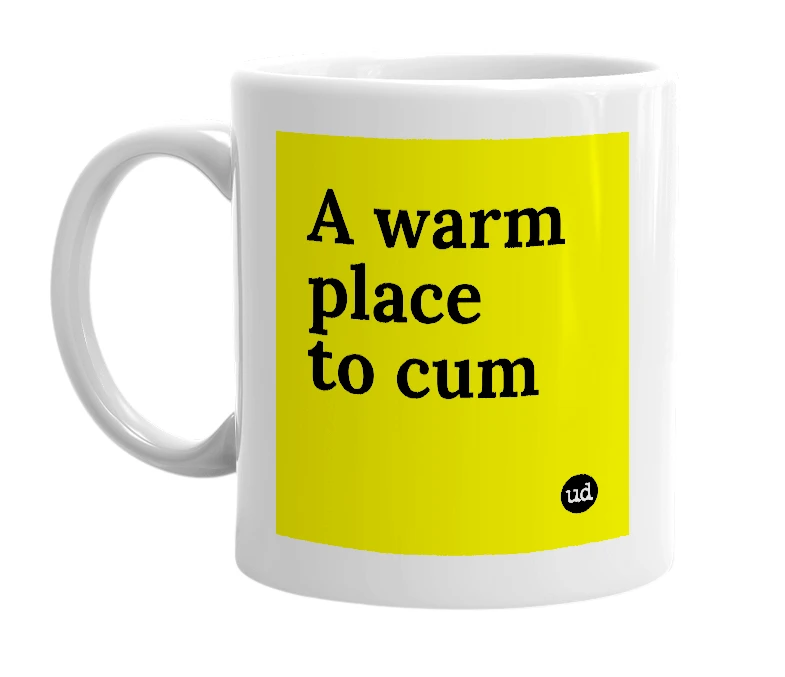 White mug with 'A warm place to cum' in bold black letters