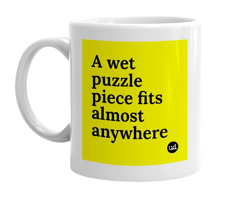 White mug with 'A wet puzzle piece fits almost anywhere' in bold black letters