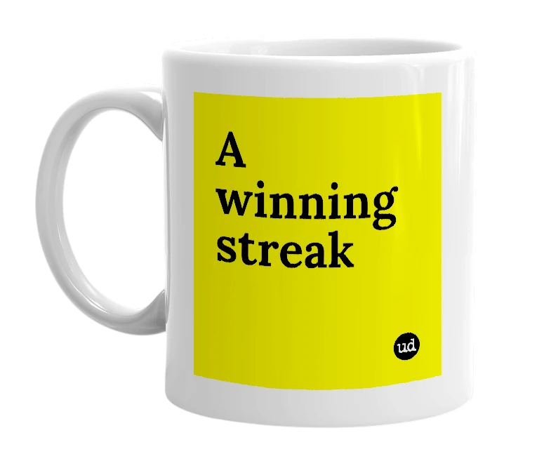 White mug with 'A winning streak' in bold black letters
