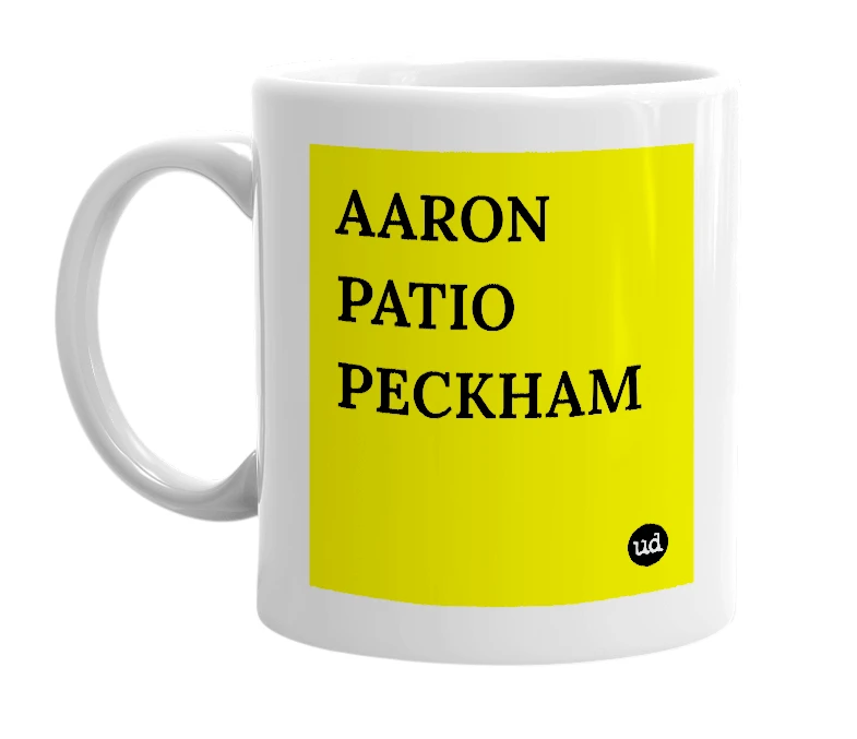 White mug with 'AARON PATIO PECKHAM' in bold black letters