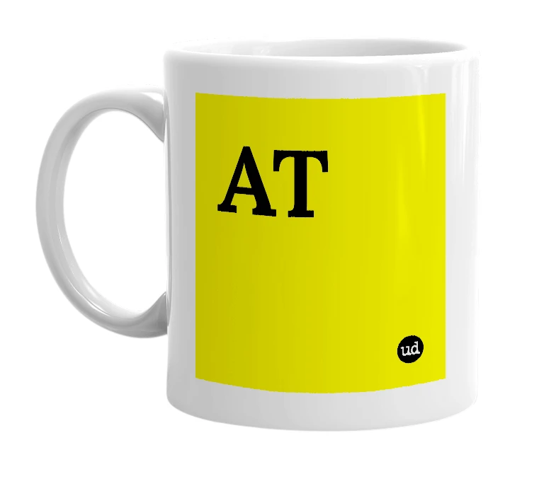 White mug with 'AT' in bold black letters